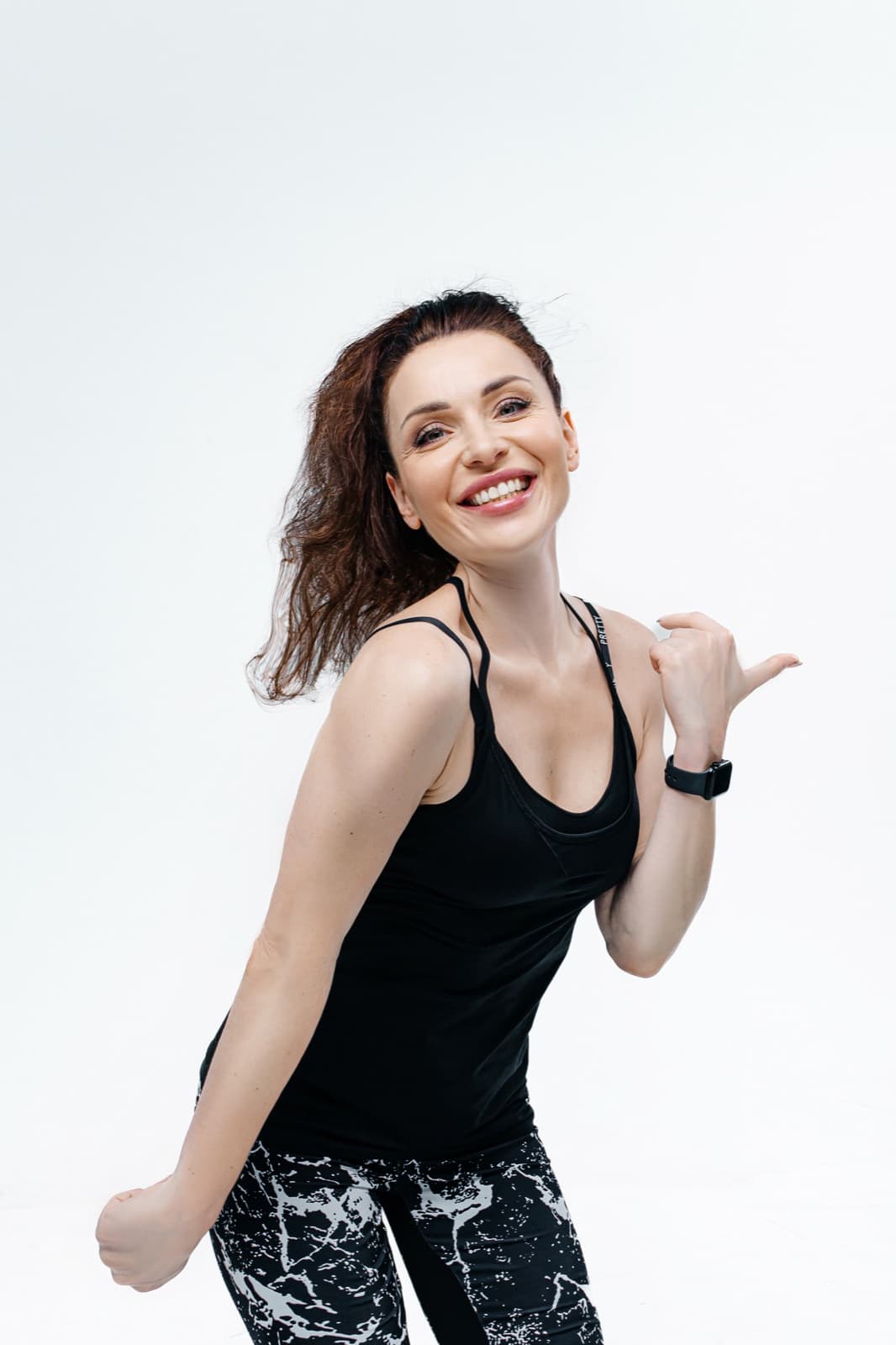 Anastasiia, the Lean Sporty instructor, smiling in a close-up dance pose