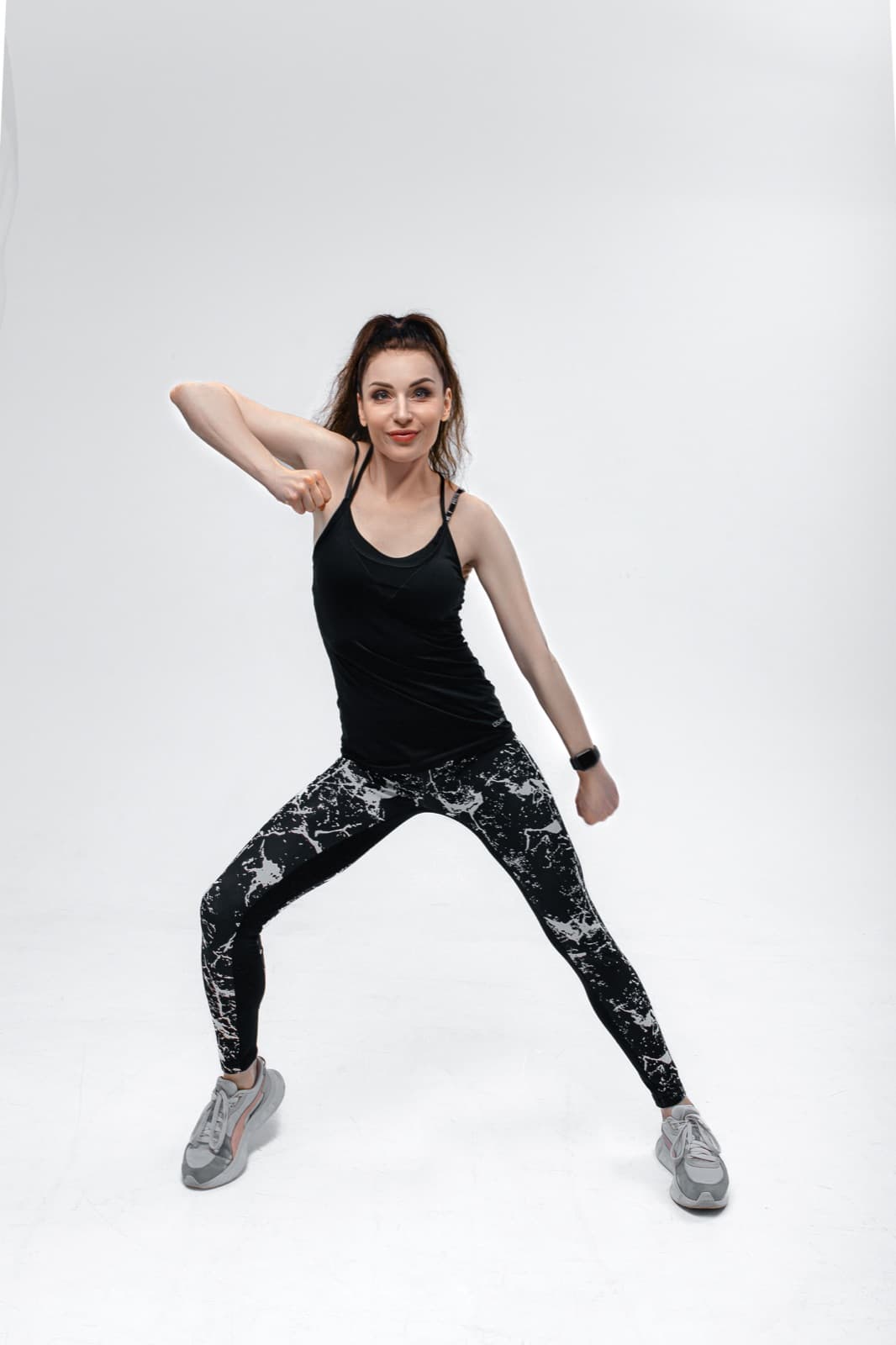 Anastasiia, the Lean Sporty instructor, dancing in a compact athletic stance